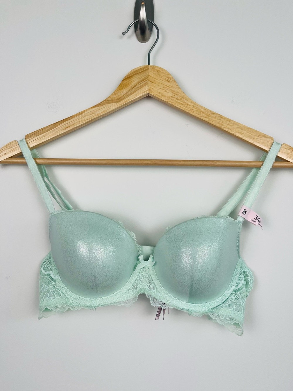 Victoriaโs Secret Dream Angels light green shimmer lightly lined bra, size 34B.